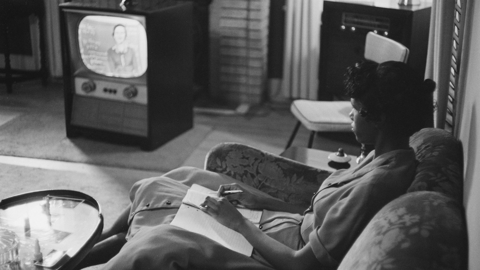 An African American high school girl being educated via television during the period that the Little Rock schools were closed to avoid integration