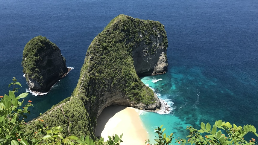 Australian tourist dies after falling from beach cliff on island near Bali