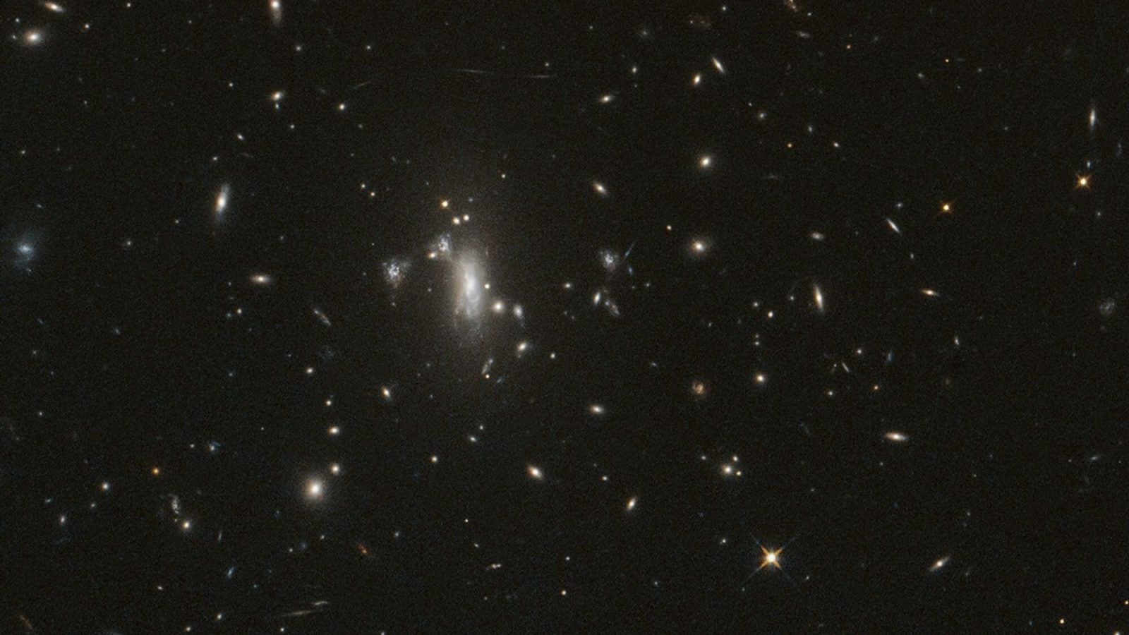 NASA's Hubble seeks lensed supernova, marks 200,000 orbits