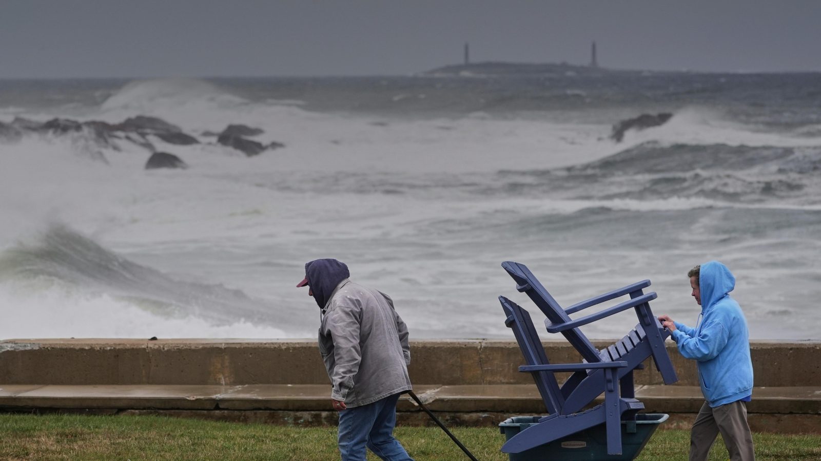 Power outages and flooded roads as major storm bears down on US north-east