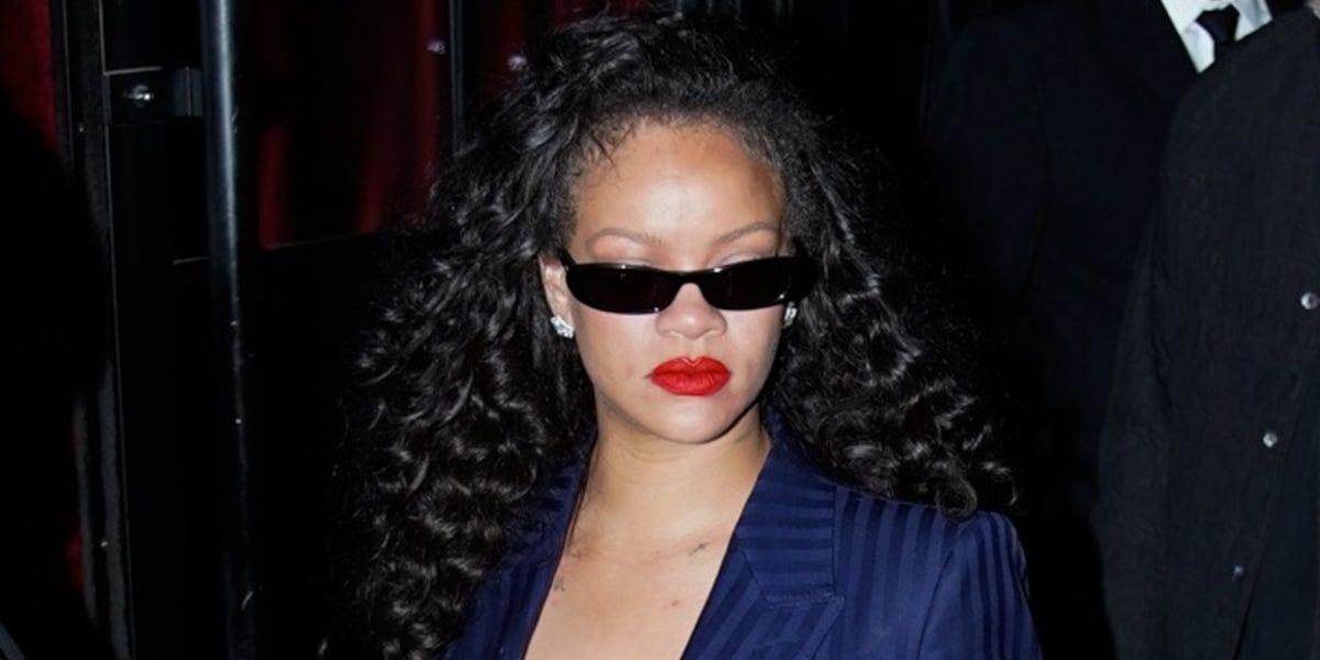 Rihanna Attends Céline Dion’s Paris Concert in a Midnight-Blue Tom Ford Suit and a Pop of Sequin Fringe