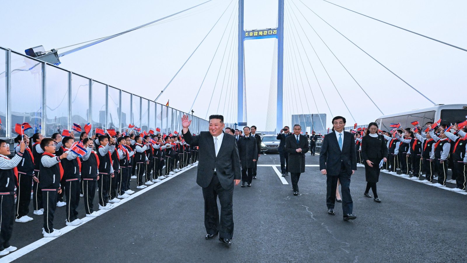Kim Jong-un crosses over newly opened bridge into China